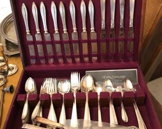 One of 2 sets of silver-plate flatware.