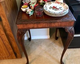 Antique Asian style table and collection of bird figures.