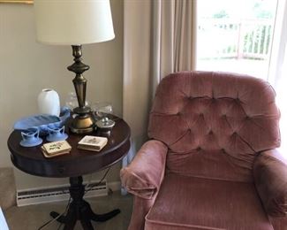 Lamp table and comfortable armchair.