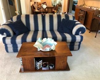 Nice clean sofa and an attractive black walnut coffee table.