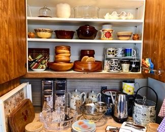 Cupboards filled with vintage kitchen items.