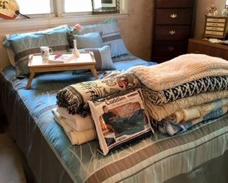 Bedroom linens, blankets and crocheted throws.