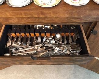 Another silver-plate flatware set.