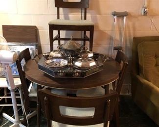 Formica table and 4 cool wood chairs.