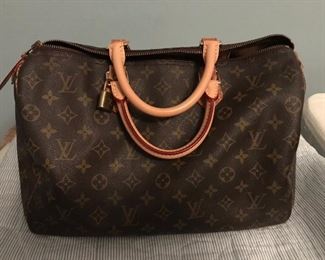149                               Large Louis Vuitton Hand Bag    $1250.