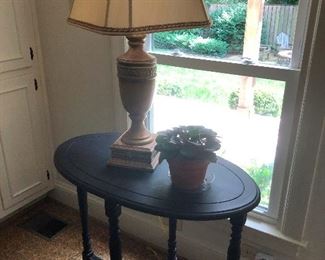 side table, lamp, sitting gargoyle