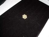 14KT yellow gold brooch containing:
1 old European cut diamond - .28ct.
6 round pearls - some seed pearls missing.