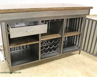  — Super Sleek Fashionable and Sought After —

BRAND NEW – UN-USED

Renegate Bar Cabinet  in the Industrial Style with he Natural Wood Top

Wine Racks, Glass Holders with Lock and His and Her Keys ♥

Auction Estimate $400-$800 – Located Inside 