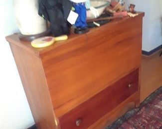 Unusual blanket chest utilizing two types of wood on the front of the chest