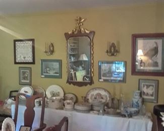 Ornate mirror, wood with gilded embellishment, many sets of game plates, turkey platters, and more