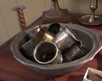 Pewter bowl full of silverplated napkin rings