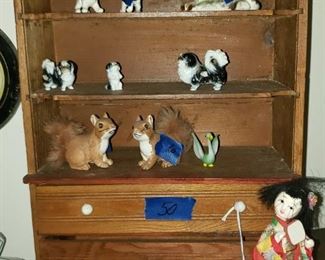 Vintage porcelain animals. Japanese doll, display shelf