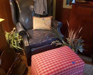 Blue leather wing chair, checkered pattern upholstery on ottoman