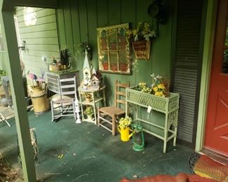 Lots of great porch decor, including bird houses, watering cans, yard art. baskets, painted windows and more