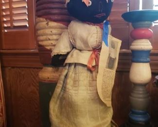Old doll and painted banisters and candlestick