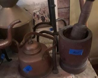 Copper kettles, wood mortar and pestle