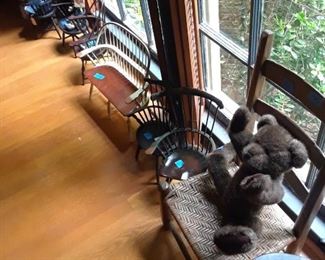 Cane seat child's chair in foreground 
with teddy; others are reproduction Windsor chairs and some ltd. Ed. Collectibles