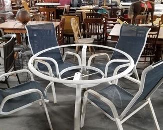4' White painted aluminum table (missing glass) & (4) aluminum & steel white painted blue mesh fabric chairs Was $150 now $85