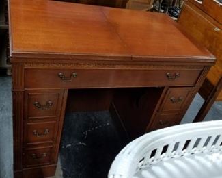 Vintage Kneehole  cherry sewing machine cabinet with New Home machine 