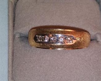 14K YG diamond band. Includes five round brilliant cut diamonds approx. 2.5mm each of SI1 clarity & H color.