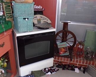 Stove, lots of misc., rolled up Rug - in the Patio Room