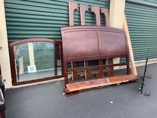 Antique mirror, king bed frame and fireplace screen
