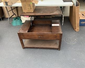 Coffee table with storage and dining riser