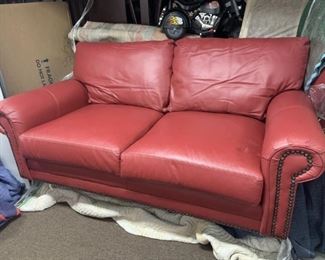 Custom leather 6 ft loveseat from Leather Creations in rustic barn red with brad detailing. Taking offers.