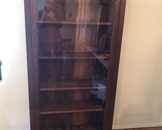 Grand Rapids Furniture Co. Glass Front Book Case/Gun Cabinet. c.1910 Signed. Original Glass & Shelves.   34" x 10" x 68" Slotted on bottom to hold 9 Rifles.  