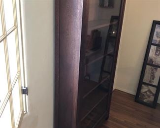 Grand Rapids Furniture Co. Glass Front Book Case/Gun Cabinet. c.1910 Signed. Original Glass & Shelves.   34" x 10" x 68" Slotted on bottom to hold 9 Rifles.  