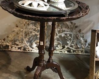 round antiqued carved table