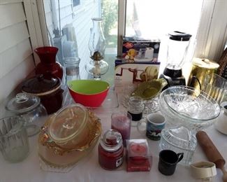 An assortment of vintage glassware Apple peelers, mixers, baking dishes, fabulous candles