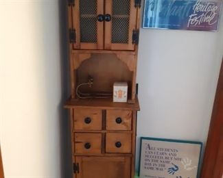 Narrow curio cabinet with drawers