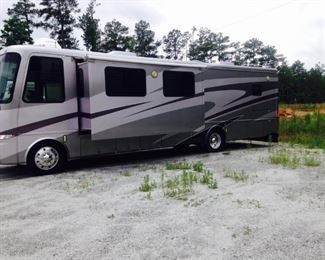 2003 Mountain Aire Class A 39 Foot Motor Home. Approx. 70,000 + miles with new engine put in 3 years ago. The new engine has about 2000 miles on it. Tires 2 years old. Includes Brake Buddy for 2003 Honda "Element" to be towed. Honda is included with Motor Home. Will not be sold separately.