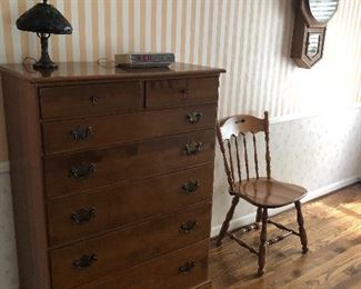 Tall chest of drawers, side chair and wall clock