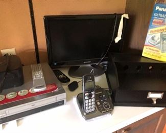 electronics:  monitor, DVD player and wood desk organizer