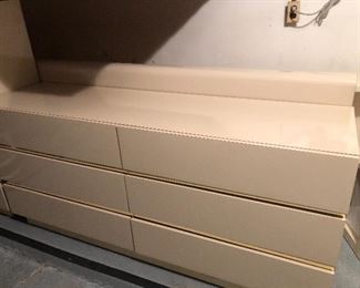 long dresser and headboard (behind dresser)