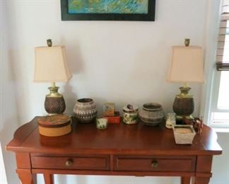 Wooden 2 drawer table/desk, lamps, Native American signed planters, etc.