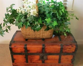Antique wooden trunk, one of many woven baskets
