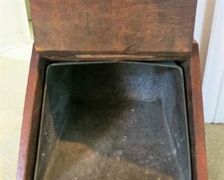Inside of antique wooden coal box including galvanized metal inset