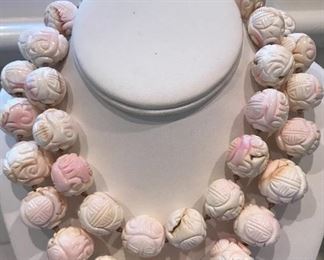 Chinese carved necklace
Coral or shell?