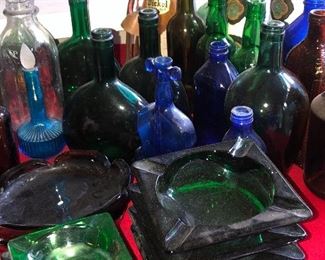 Colored glass ashtrays, bottles