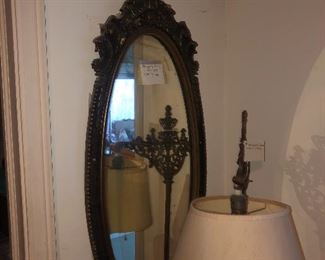 Fancy gilt oval mirror