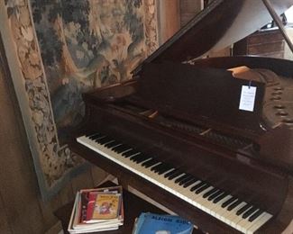1926 Steinway & Sons grand piano and bench and (background) a wall mounted 74" x 108" Antique Handwoven tapestry believed to be a late 19th century French Verdure Aubusson handwoven tapestry