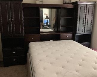 Queen Bed Beautyrest mattress box spring and book cases.   Mirrored head board has a light and electrical outlet in the center