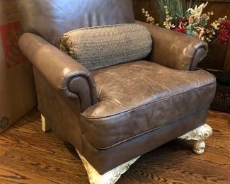 Blond wood accents leather upholstery in this fabulous chair. 