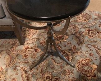 Marble & brass accent table shows off a beautiful area rug. 