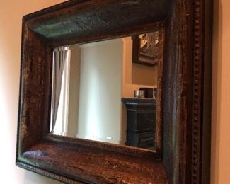 Heavy-frame mirror provides solid accents to any room. 