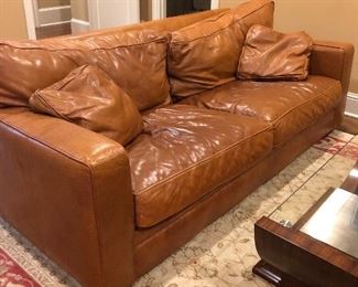 Comfy leather sofa in attractive caramel. 