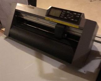 Graphtec Cutting Plotter is similar to a Cricket but for industrial applications.  This Graphtec Cutting Plotter CE6000-40 accepts designs created on your computer.  